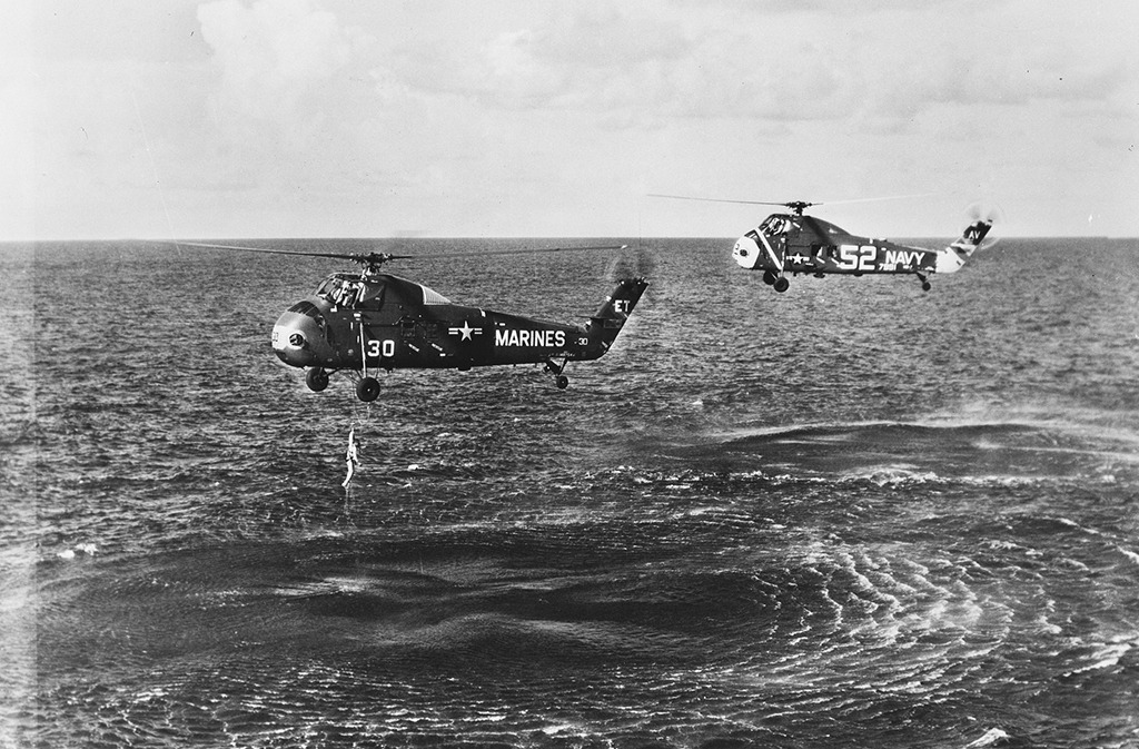 Marine helicopters rescuing astronaut Gus Grissom out of the ocean