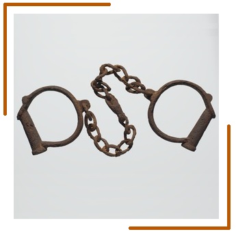 Two iron shackles consisting of iron loops joined together by a length of iron chain.