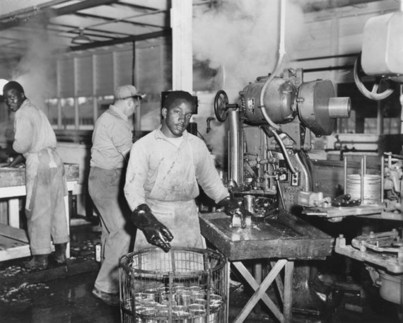 Incarcerated men processing canned food in a prison labor camp in Caswell, North Carolina, 1945.