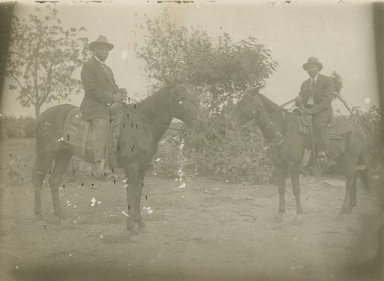 Two African American men on horseback
